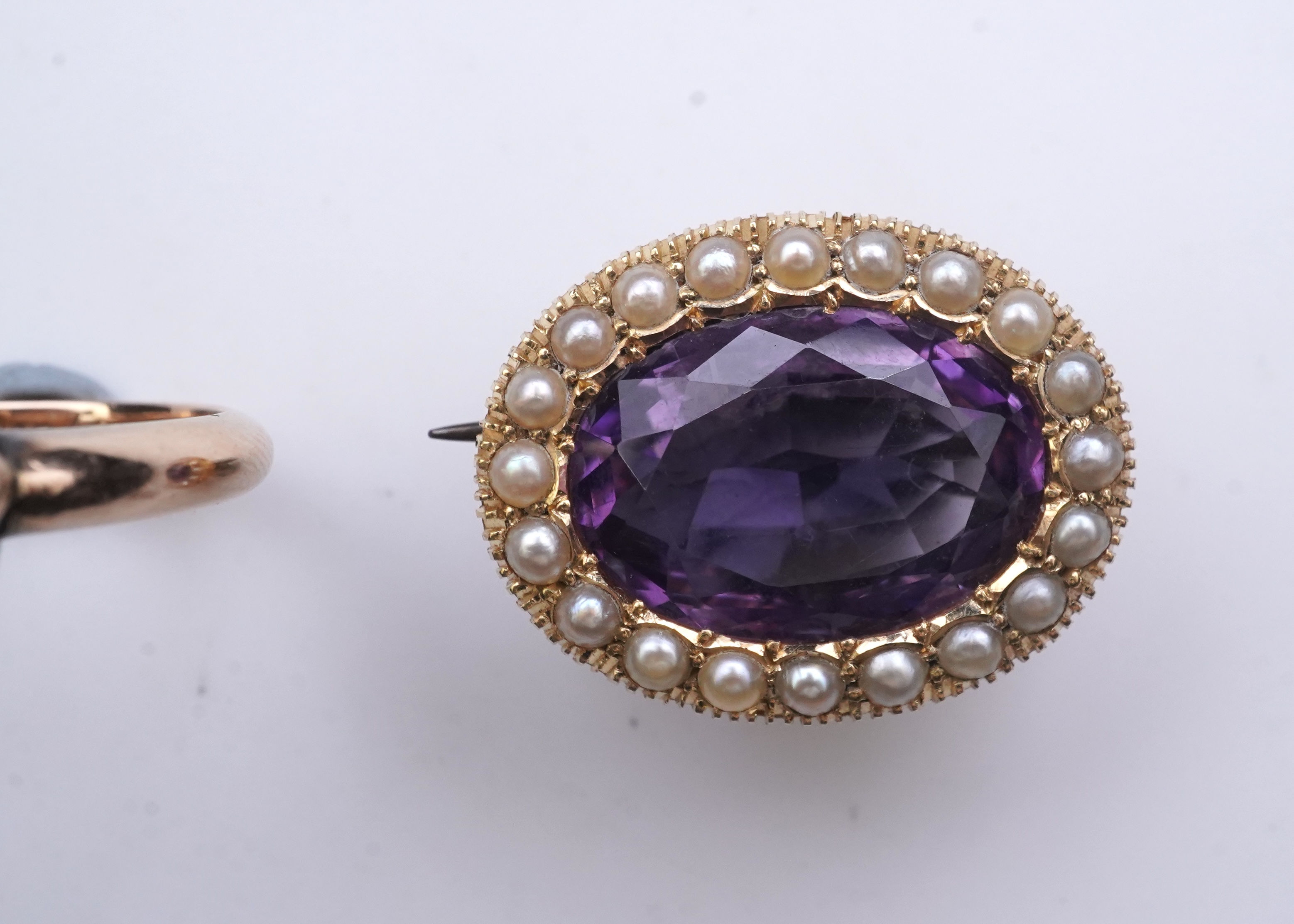 An amethyst brooch and an amethyst mourning ring, early 20th century